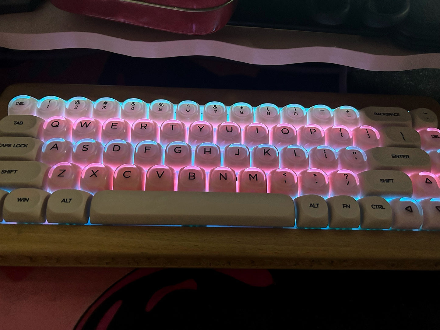 Keyboard with RGB lighting on a wooden desk