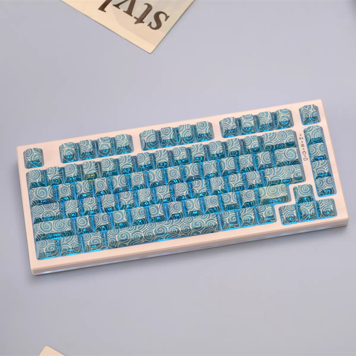Ocean Swirl Side Engraved keycaps on keyboard