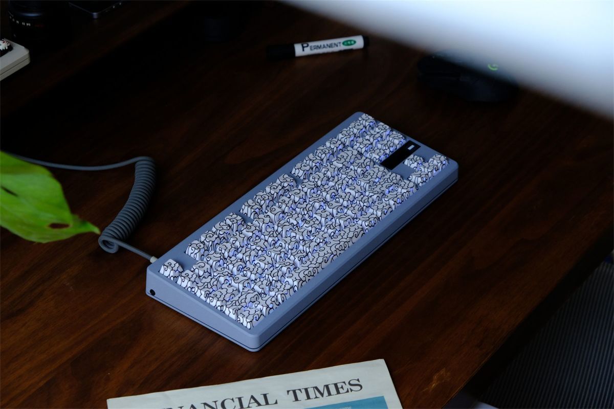White Ink Swirl Side Engraved Keycaps Bangladesh on a wooden desk